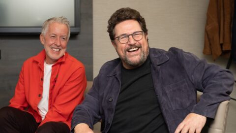 Michael Ball and Tim Hubbard sitting down and laughing.